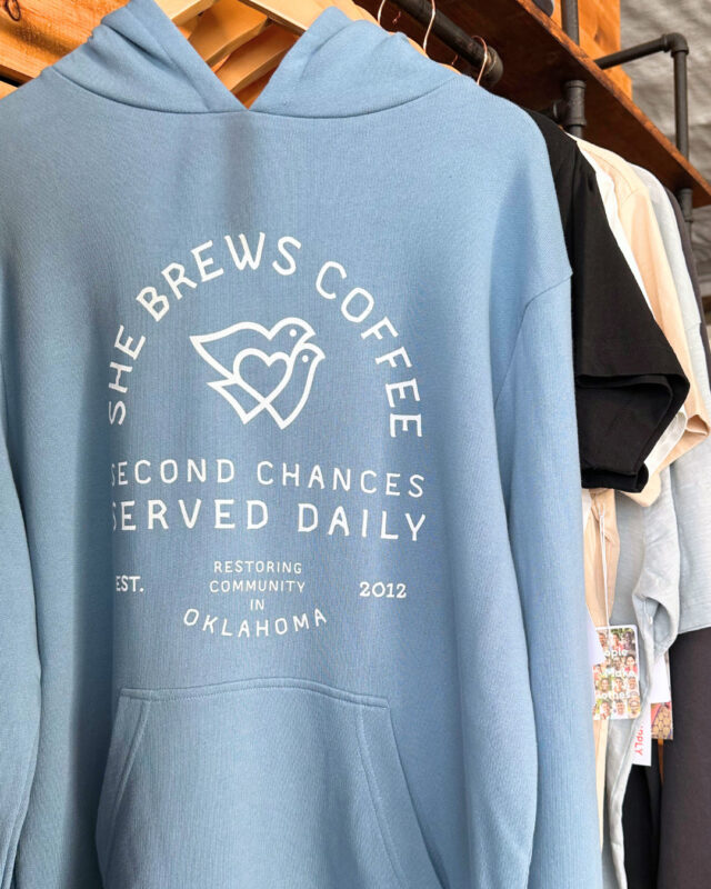 New year, new She Brews fits! We have a bunch of awesome all-new She Brews merch, including t-shirts, hoodies, hats, and tote bags—made ethically by the folks @knownsupply. Stop by one of our shops to grab your favorites today, or shop online at the link in our bio!⁠
⁠
#CoffeeWithACause #SheBrewsTransitionProgram #TransitionProgram #SheBrews #BrewingUpPurpose #NonprofitCoffee #Tulsa #Claremore